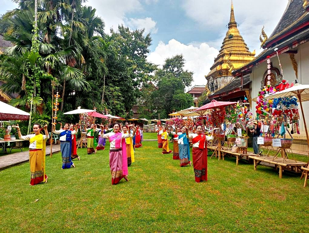 Lanna dancers in traditional dress during a Songkran temple procession